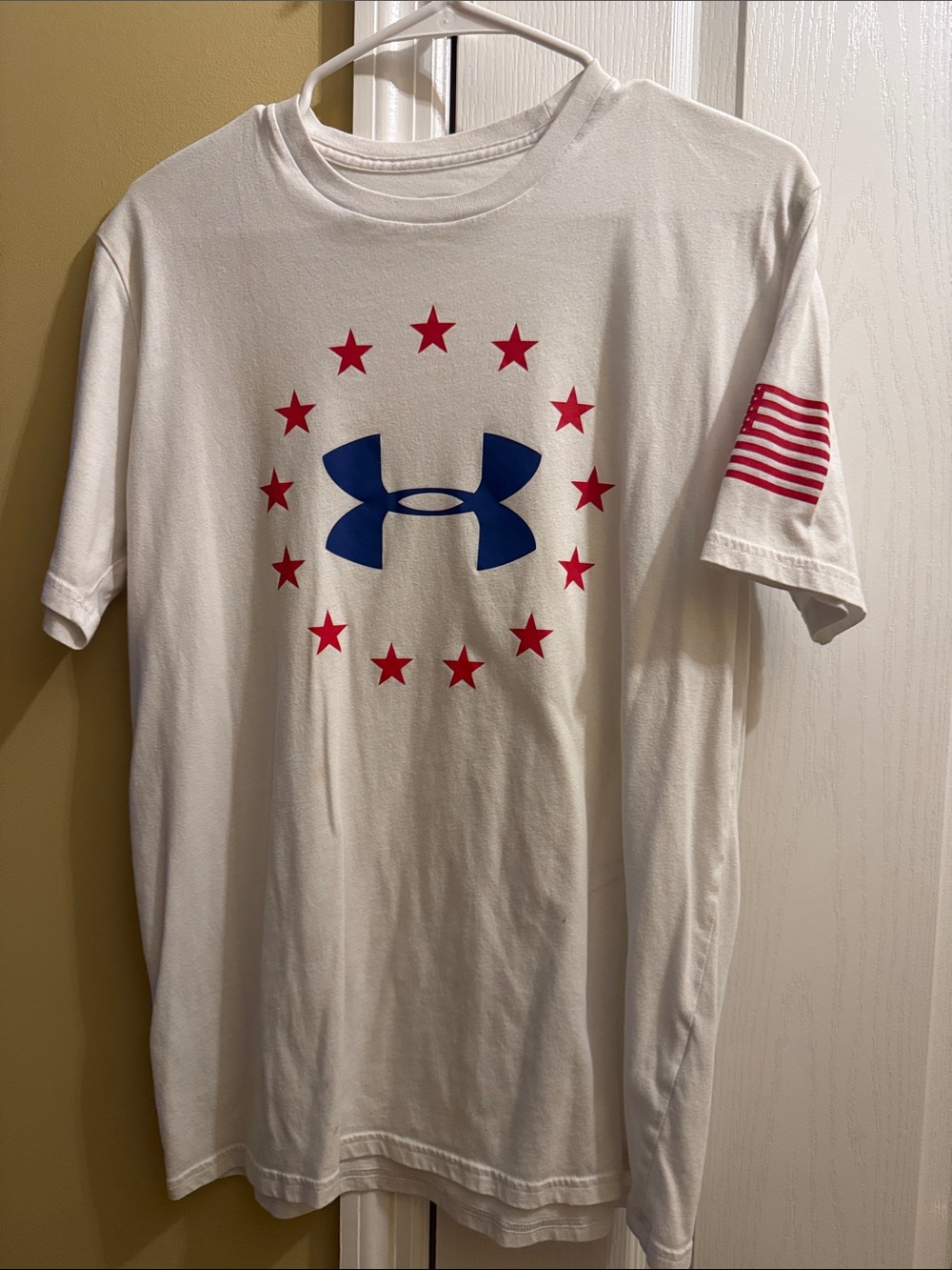 Under Armour White Tee with Blue Logo and Red Star Ring